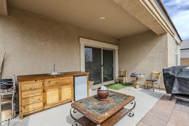 view of patio / terrace featuring a sink