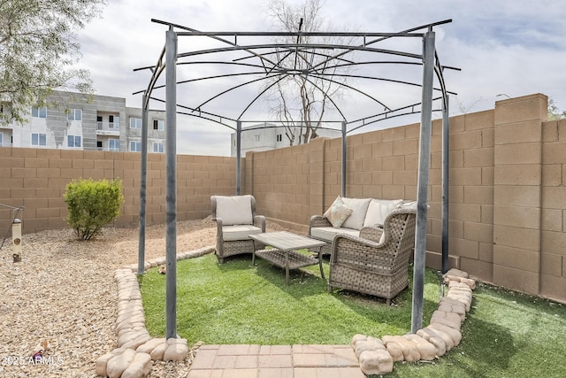 view of patio / terrace featuring a fenced backyard and an outdoor living space