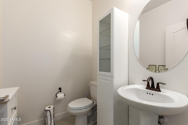 10545 E Texas Ave, Mesa, AZ 85212 - bathroom with toilet, a sink, and baseboards