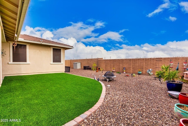 10545 E Texas Ave, Mesa, AZ 85212 - view of yard with a fire pit and central air condition unit