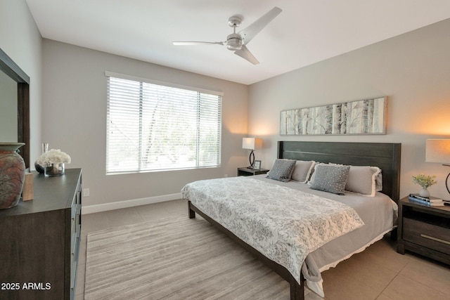 16935 W Sheridan St, Goodyear, AZ 85395 - bedroom with light tile patterned floors, baseboards, and ceiling fan