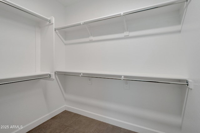 16935 W Sheridan St, Goodyear, AZ 85395 - spacious closet featuring dark tile patterned flooring