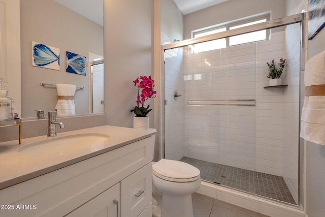 16935 W Sheridan St, Goodyear, AZ 85395 - full bath featuring toilet, a stall shower, tile patterned floors, and vanity
