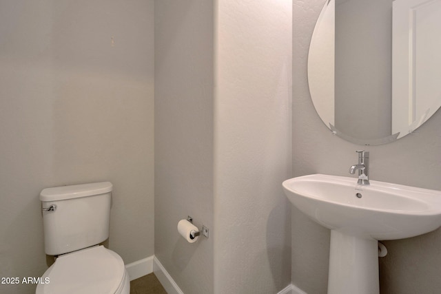 16935 W Sheridan St, Goodyear, AZ 85395 - half bathroom featuring toilet and baseboards