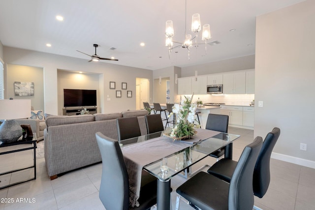 16935 W Sheridan St, Goodyear, AZ 85395 - dining room with a chandelier, light tile patterned flooring, a ceiling fan, recessed lighting, and baseboards