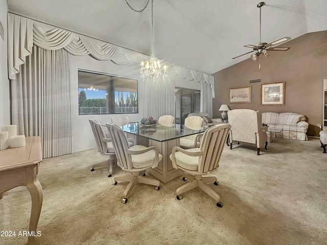 dining room featuring ceiling fan with notable chandelier, lofted ceiling, and a textured ceiling