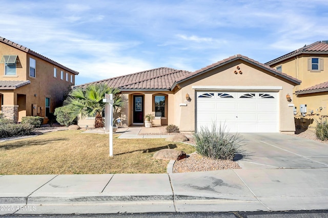 mediterranean / spanish-style house with a garage and a front yard