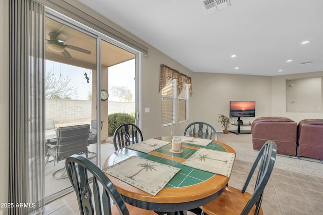 dining room with light tile patterned floors and ceiling fan