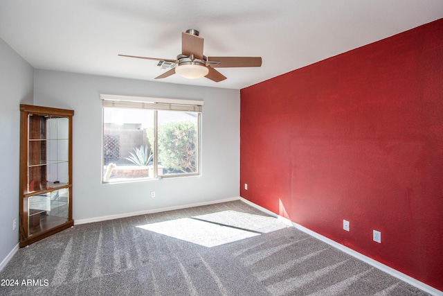 empty room with carpet and ceiling fan