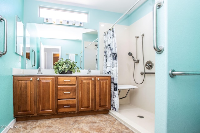 bathroom featuring a shower with shower curtain, vanity, and tile patterned flooring