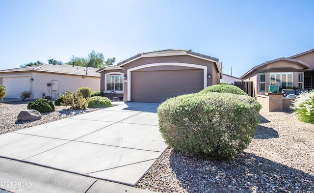 ranch-style home featuring a garage