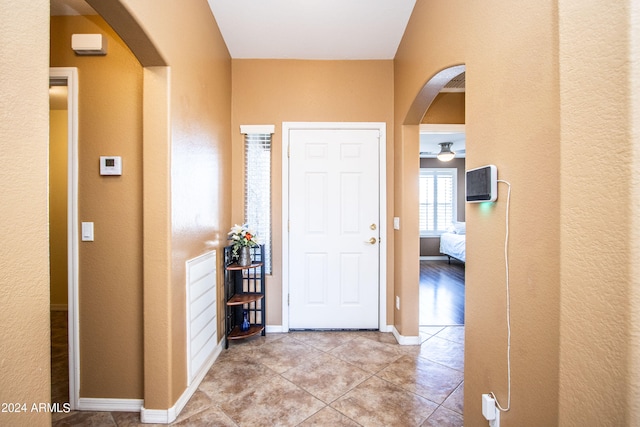 foyer entrance with light tile patterned floors