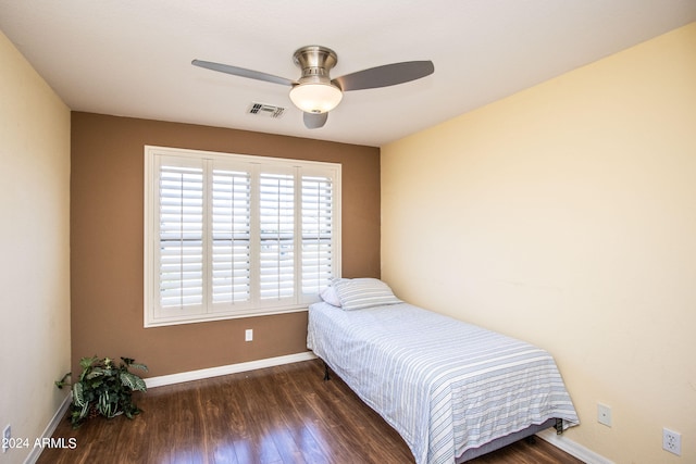 bedroom featuring dark hardwood / wood-style flooring and ceiling fan