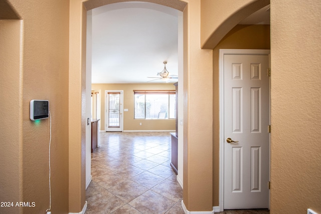 corridor featuring light tile patterned floors