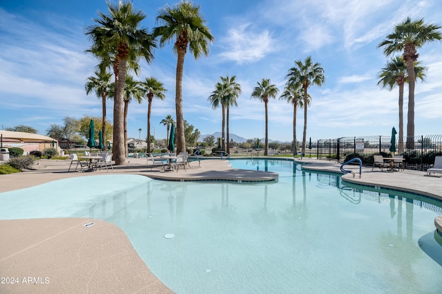 view of swimming pool featuring a patio area