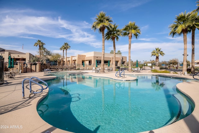 view of swimming pool featuring a patio area