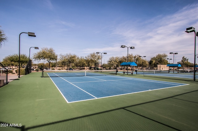 view of tennis court featuring basketball court