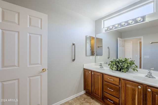 bathroom with tile patterned flooring and vanity