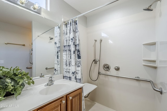 bathroom with a shower with curtain and vanity