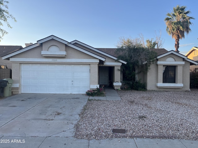 7760 W Palmaire Ave, Glendale, AZ 85303 - ranch-style home with concrete driveway, an attached garage, and stucco siding