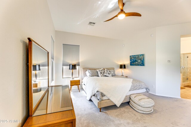 bedroom featuring ceiling fan, connected bathroom, and carpet floors