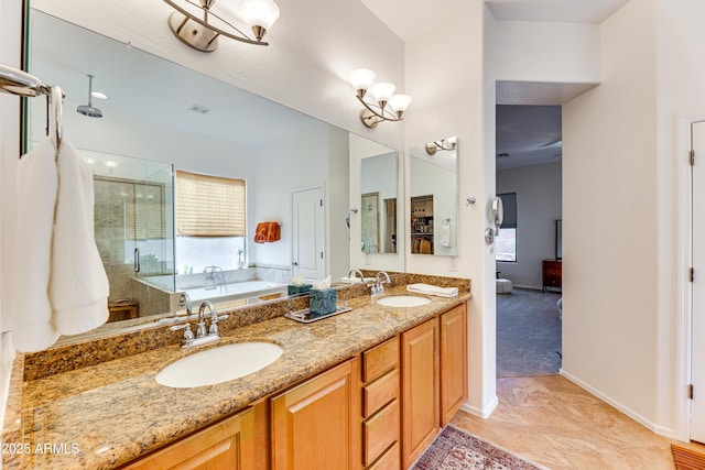 bathroom with vanity, tile patterned floors, and shower with separate bathtub