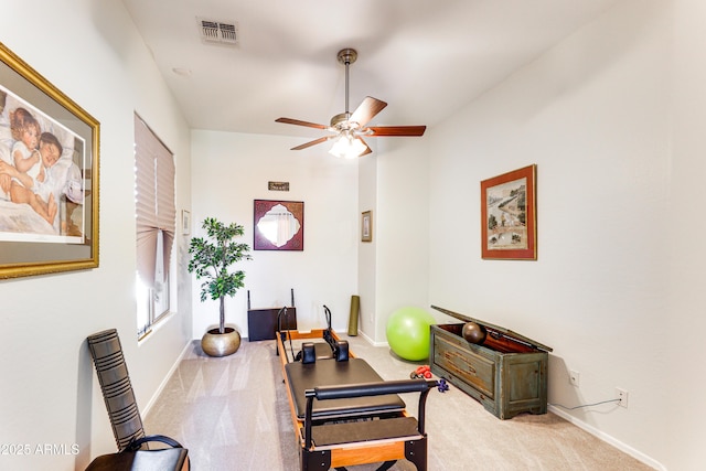 interior space featuring ceiling fan and carpet flooring