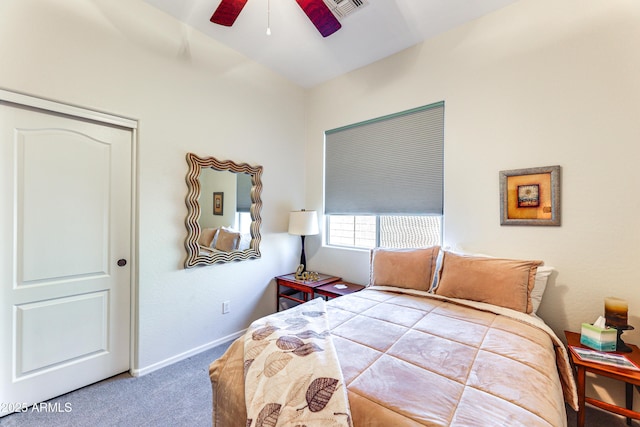 carpeted bedroom with ceiling fan and a closet