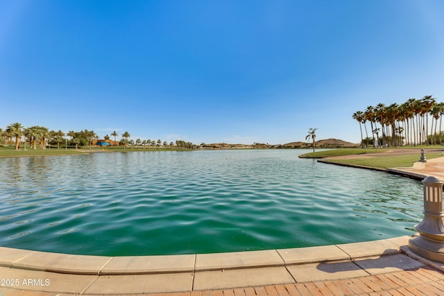 view of pool featuring a water view