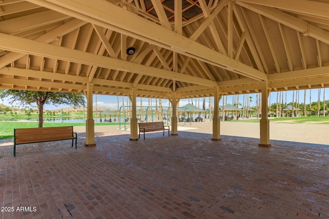 view of property's community with a gazebo and a water view