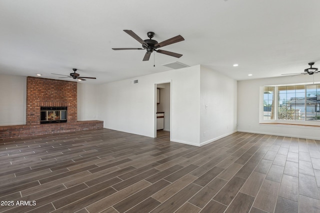 unfurnished living room with wood finish floors, a fireplace, recessed lighting, visible vents, and ceiling fan