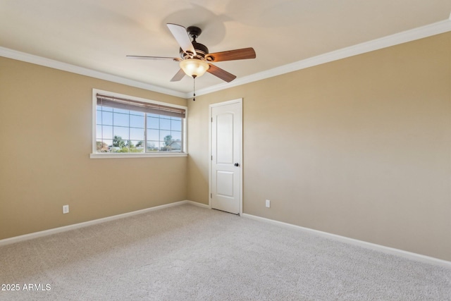 unfurnished room featuring ceiling fan, baseboards, crown molding, and light colored carpet