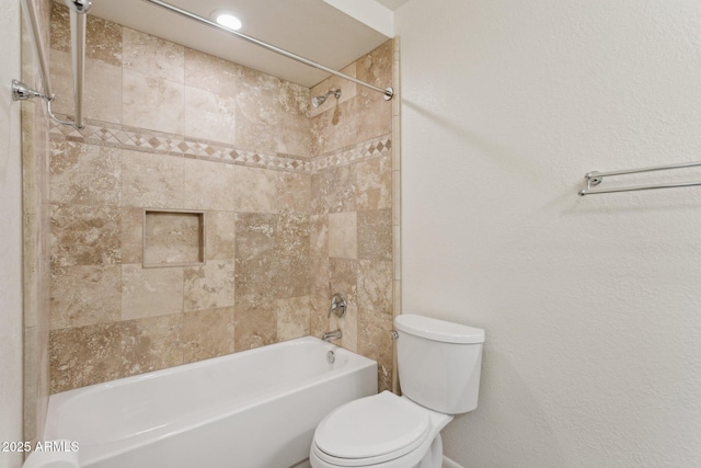 full bathroom featuring tub / shower combination and toilet