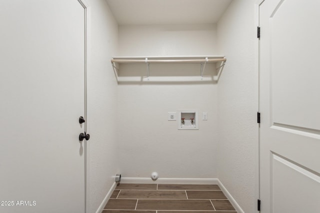 washroom featuring baseboards, laundry area, hookup for a washing machine, and wood tiled floor