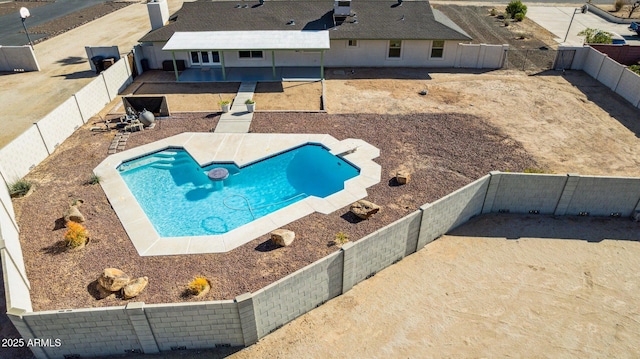 view of swimming pool with a patio area, a fenced backyard, and a fenced in pool