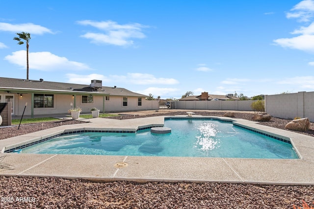 view of swimming pool featuring a fenced in pool, central AC unit, a patio area, a fenced backyard, and a jacuzzi