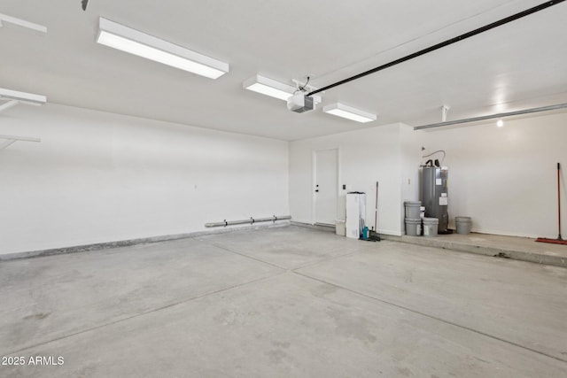 garage featuring electric water heater and a garage door opener