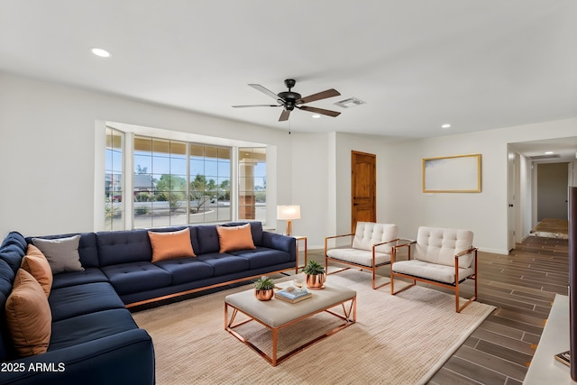 living area featuring recessed lighting, baseboards, and wood finish floors