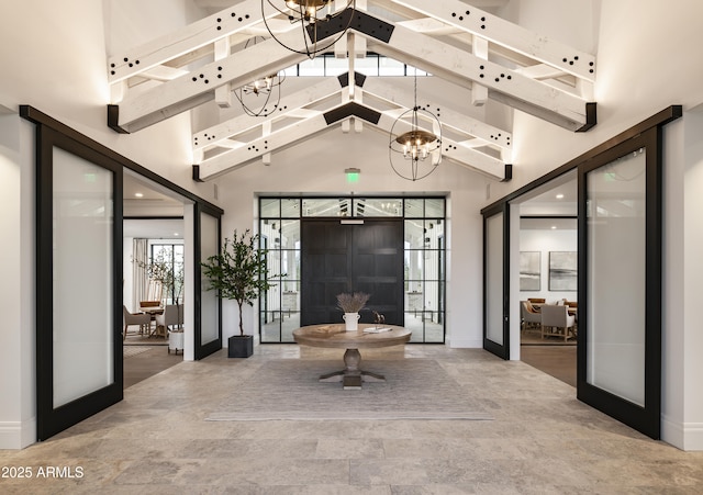interior space with french doors, baseboards, high vaulted ceiling, and beam ceiling