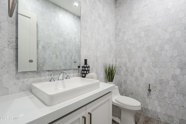 bathroom with vanity and toilet