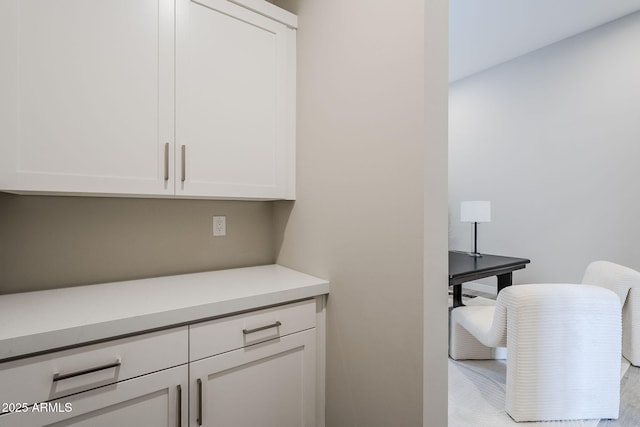 bar with white cabinetry