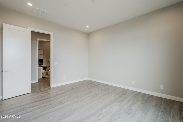 unfurnished room with light hardwood / wood-style flooring