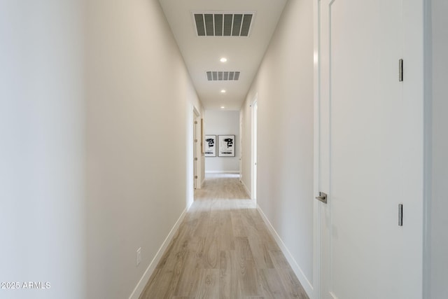 corridor featuring light hardwood / wood-style floors