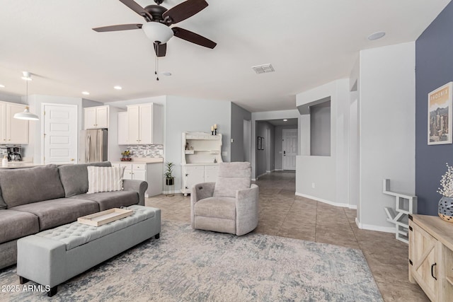 tiled living room with ceiling fan