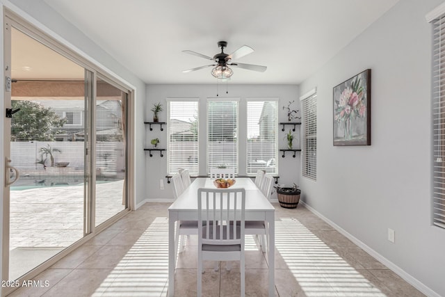 dining room featuring ceiling fan and light tile patterned flooring