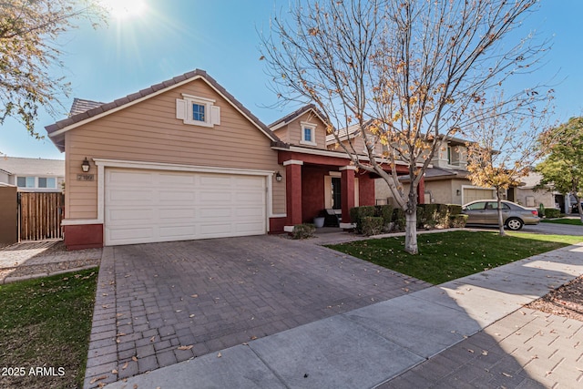 view of front facade with a front lawn and a garage