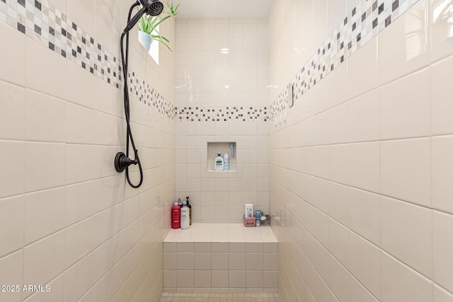 bathroom featuring tiled shower