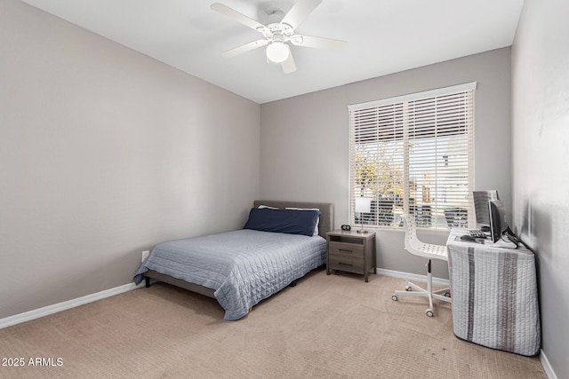 bedroom with ceiling fan and light colored carpet