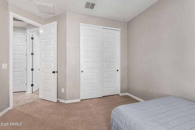 carpeted bedroom featuring a closet