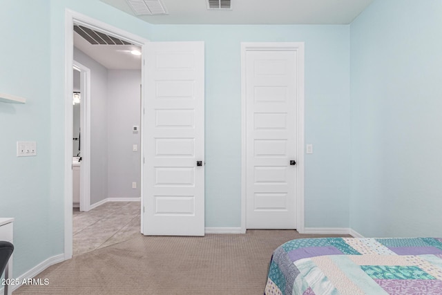 bedroom with light colored carpet